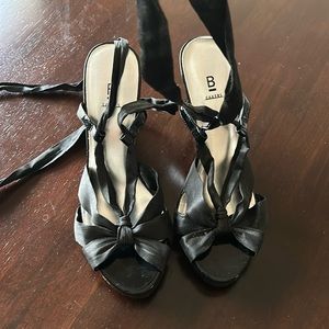 Cute satin material lace up wedges.   The wedge part is black patent leather.